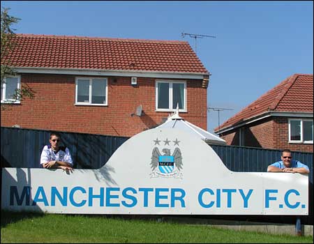 City fans with sign