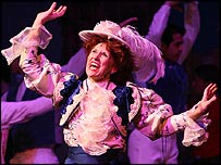 Anita Dobson on stage performing as Dolly