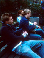 Teenagers smoking on a bench