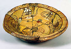 Slip-decorated earthenware dish with sgraffito design of bird and worm, made at Brookhill Pottery, Buckley, c.1640-1670 