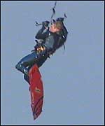 A surfer performs a trick