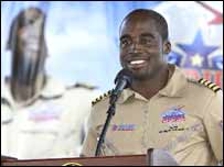 Barrington talking to the press at the end of his trip