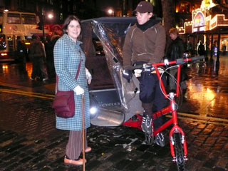 In the rainy evening streets, Kate finds a rickshaw
