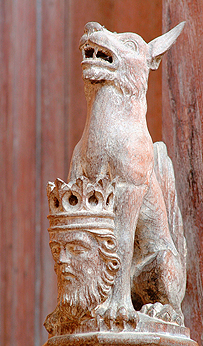 Carving of wolf and St Edmund's head 