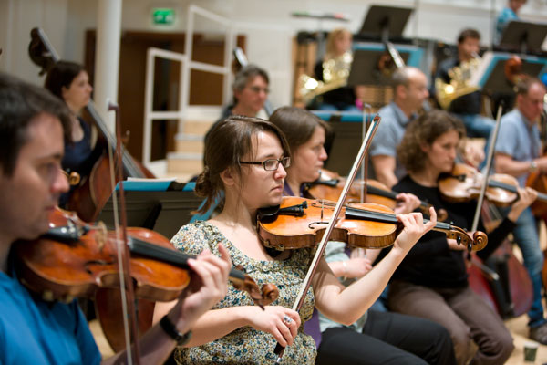 Amy Cardigan and some of the first violins of the BBC SSO