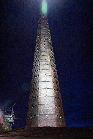 Dixons Chimney, flloodlit at night.