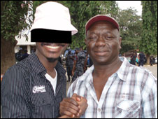 Anas Aremeyaw (masked) and Sorious Samura in Ghana