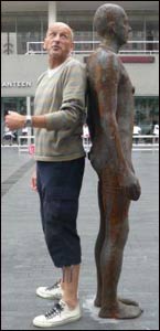 Stephen Keeler standing next to Gormley statue