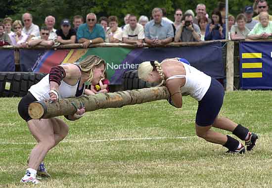 The Pole Push was a new women's game in 2004 and proved very popular with the crowds and athletes alike. Here, from left to right, we see strongwoman Ielja Strik from Holland try to push equally powerful Heini Koivuniemi of Finland out of the white circle. The Fin eventually toppled Ielja.