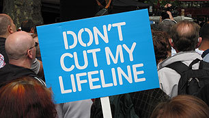 A placard held by a protester during the Hardest Hit march