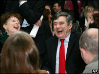 Gordon Brown laughing with a few others