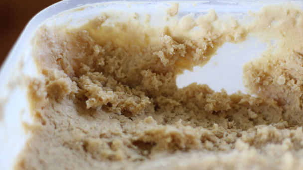 Freezing coffee ice cream without a machine creates large ice crystals and a rough texture.