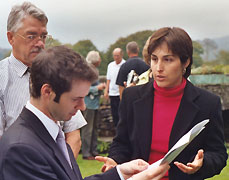 Sheila being interviewed by a BBC reporter with Dean Clough at Plas Brondanw
