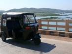 Rickshaw passing over bridge, India
