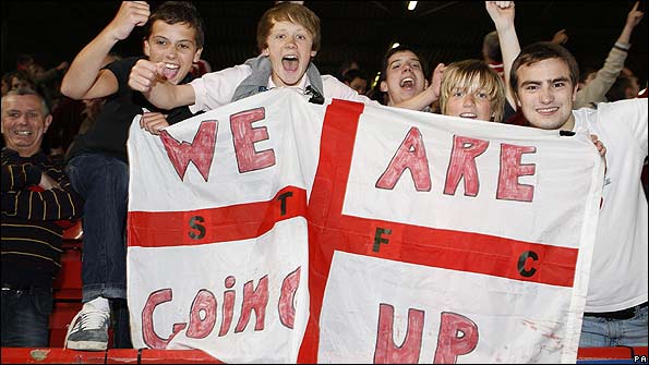 Swindon fans celebrate after their team reached the play-off final