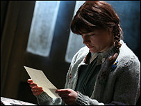 Eva (Matti Houghton) reading a letter