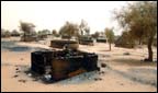Burnt out huts in Sudan
