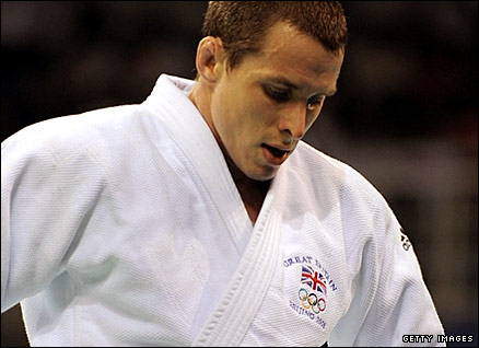 Britain's Euan Burton reacts after going out of the Olympics