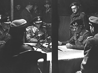 4 May 1945: Field Marshal Sir Bernard Montgomery signs the surrender of German armies in the north