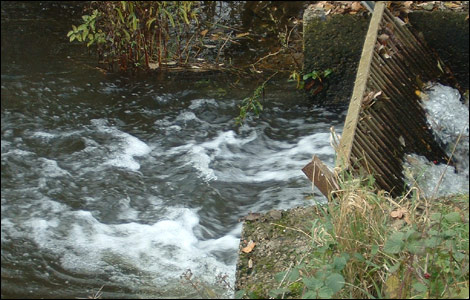 Water pours through a small sluice