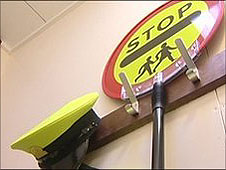 Lollipop person's clothes and sign