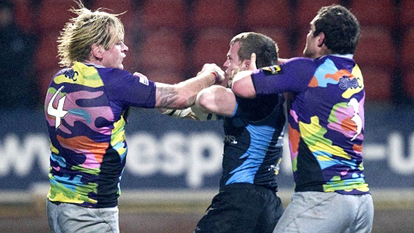 Edinburgh's Scott MacLeod and Glasgow's Chris Fusaro exchange blows in the first leg of the 1872 Cup. Photo: SNS