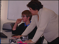 Teacher Sue Andrews with a news reporter