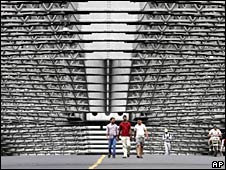Commuters walk on a deserted Howrah Bridge during a 12-hour general strike in Calcutta, India, Tuesday, April 27, 2010.