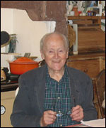 Man holding spectacles