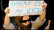 An Iranian woman carries a sign saying "where is my vote?" on the streets of Tehran