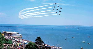 Planes flying past Southend Pier at an airshow.