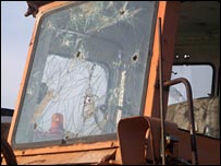 Bullet holes in the windscreen