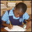 Child doing homework in Ghana