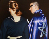 Wiccan priest and priestess in robes with five-pointed star embroidered on them