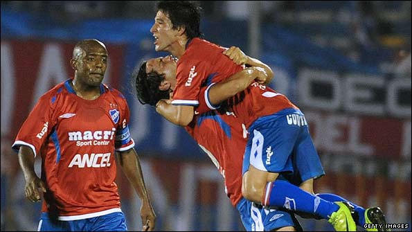Alvaro Gonzalez and Nicolas Lodeiro celebrate a goal for Nacional