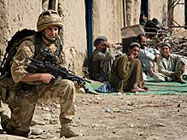 A British soldier patrolling in Sangin, Helmand Province