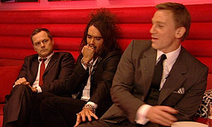 Russell Brand and Daniel Craig with Jack Dee looking on