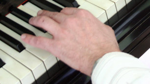 Left hand playing piano
