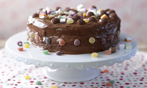 Chocolate cake decorated in sweets.