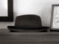 hat on a mantlepiece