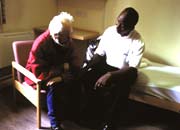 Key worker and resident in a hostel room