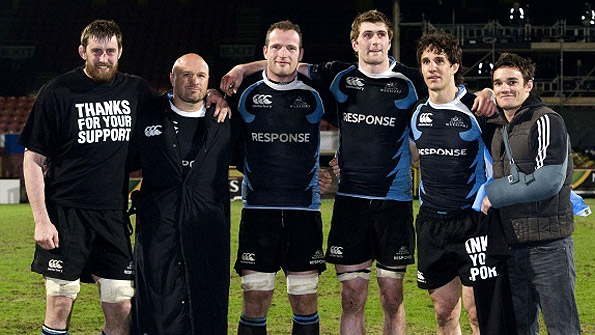 James Eddie, third from left, joins five other Glasgow Warriors players to say goodbye to the fans at Firhill. Photo: SNS