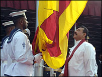 Rajapaksa hoisting the national flag on independence day (photo Sudath Silva)