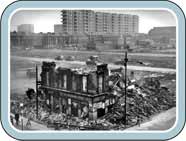High rise flats and an old, demolished building