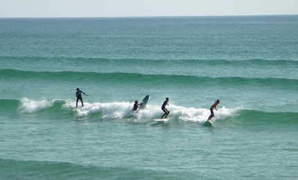 Three up one coming through- French surfers are pretty tolerant and courteous towards the tourists with the bic rentals. During weekdays you find plenty of uncrowded waves if you don’t like sharing. Pic: David Gibson , Brittany, 06