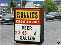 Mock sign advertising beer, mimicking a gas station sign