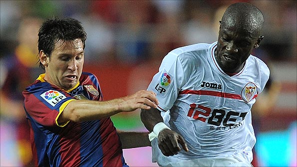 Zokora challenges Messi during a game in Seville in August. Photo: Getty Images