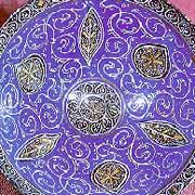 Gold and blue bowl with pattern of vine and leaf motifs