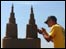 Man working on a sand sculpture