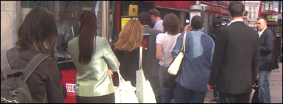 People queuing for a bus in London